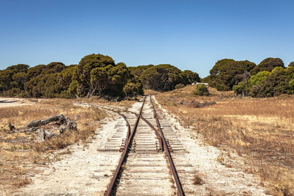 Picture of an abandoned railway surrounded by greenery in Rotness Island in Australia